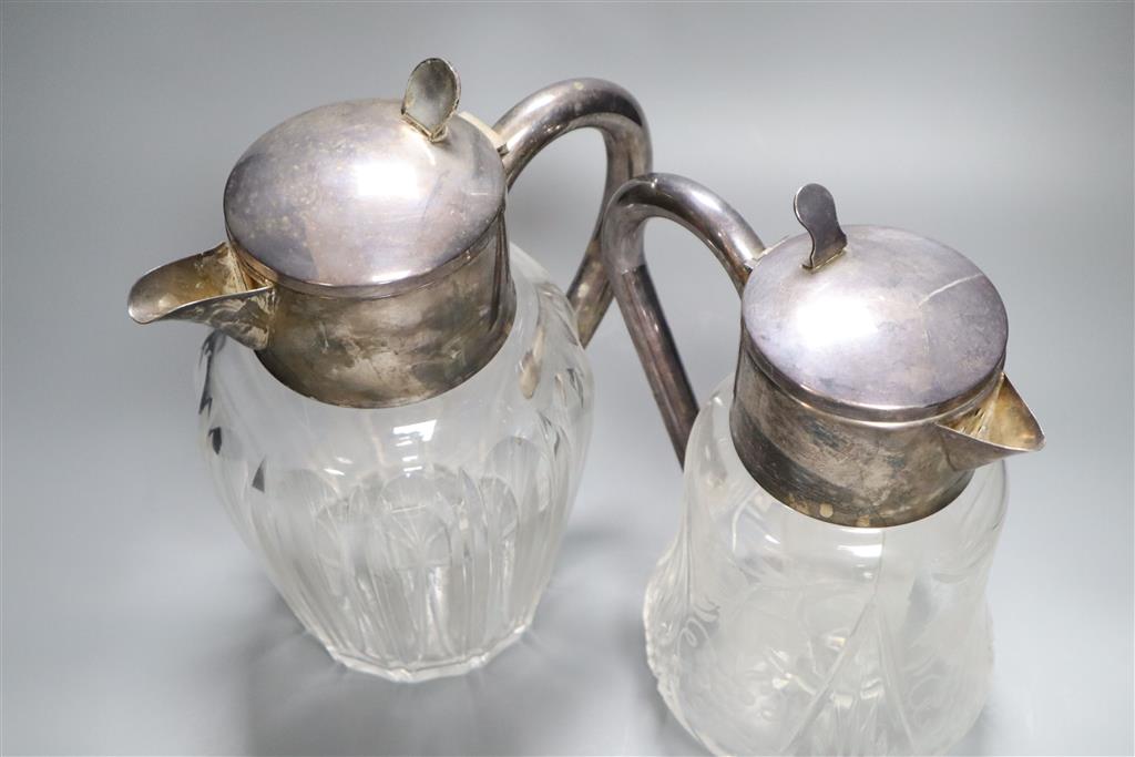 Two silver plated and glass lemonade jugs, 27cm and 24cm